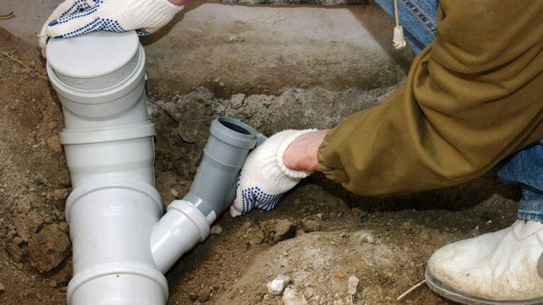 Plumber-assembling-pvc-sewage-48326390-2048x1587-1